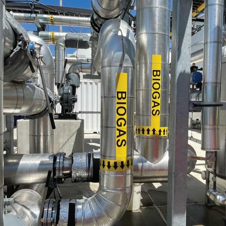 Generate Upcycle biogas pipeline system with yellow warning labels